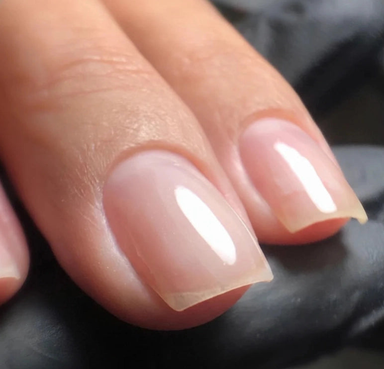 Close-up of natural nails finished with Silcare High Light LED Blue UV/LED builder gel, showcasing a crystal-clear transparent finish with a smooth high-gloss surface that enhances the natural nail. Professional self-levelling builder gel for overlays, nail strengthening, extensions and salon-quality manicures – Silcare Australia.