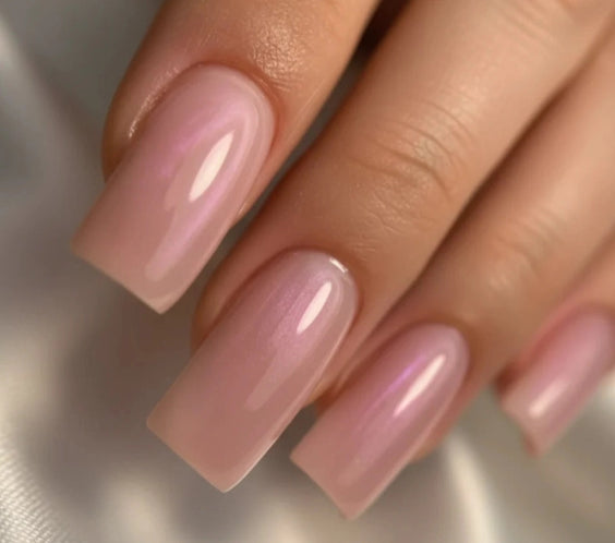Close-up of glossy square nails finished with Silcare High Light LED Pink Aura builder gel, featuring a translucent milky pink colour with luminous iridescent pearl shimmer, smooth self-levelling finish and elegant salon-quality nail enhancement – Silcare Australia.
