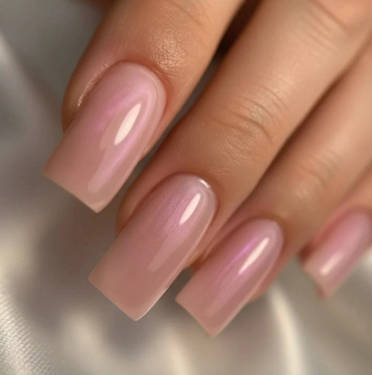 Close-up of glossy square nails finished with Silcare High Light LED Pink Aura builder gel, featuring a translucent milky pink colour with luminous iridescent pearl shimmer, smooth self-levelling finish and elegant salon-quality nail enhancement – Silcare Australia.