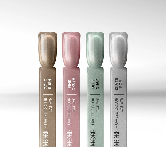 Four nail display sticks featuring the Silcare maniMORE Cat Eye collection: Gold Rush, Pink Crush, Blue Snap, and Silver Pop shimmering magnetic gel polishes.