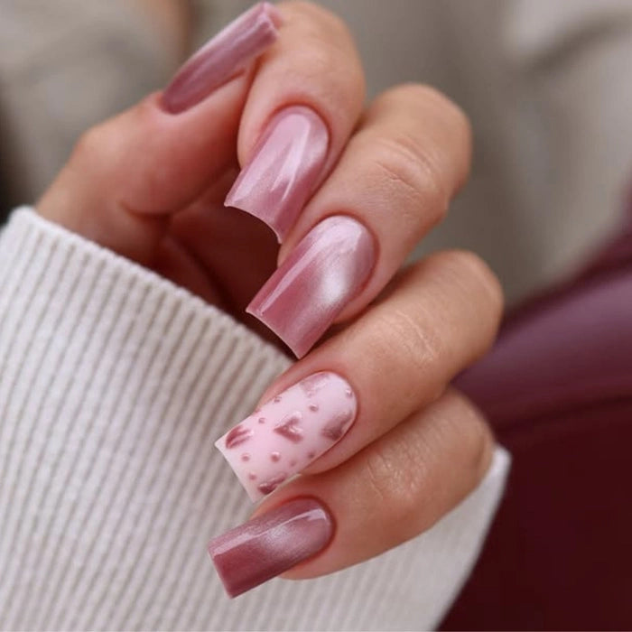 A professional manicure using Silcare maniMORE Pink Crush Cat Eye gel polish on square nails, including a matte accent nail with 3D pink magnetic heart nail art.