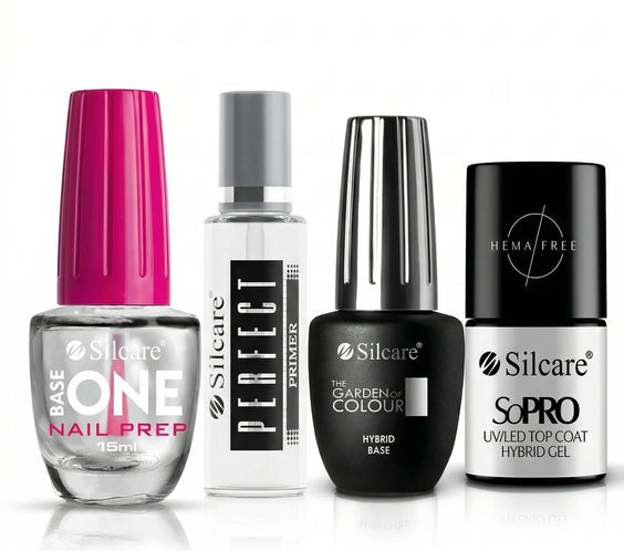 Four professional Silcare nail care products arranged in a row: Base One Nail Prep, Perfect Primer, The Garden of Colour Hybrid Base, and SoPRO HEMA Free UV/LED Top Coat Hybrid Gel. High-quality salon manicure essentials on a white reflective background.
