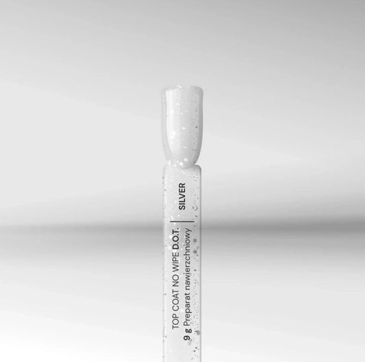 Close-up of Silcare silver no wipe gel top coat bottle and brush tip with fine glitter particles on a neutral background, showing glossy UV LED nail finish